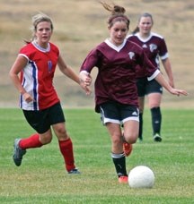 Foothills Falcon Daniela Espino kicks the ball up the pitch during the Falcons&#8217; 10-0 win over the Strathmore Spartans, Sept. 25 at Kinsmen Field in Okotoks.