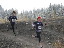 Claudia Belanger is in front of fellow Strathcona-Tweedsmuir School Spartan Gillian Ceyhan in the Intermediate girls 4,000m at the South Central Zone final in Canmore on Oct. 