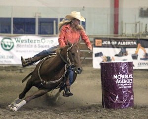 Adel Hansen and Freddie turn a barrel at the Okotoks Pro Rodeo in September. Both horse and rider have been working out for the upcoming Canadian Finals Rodeo in Edmonton,