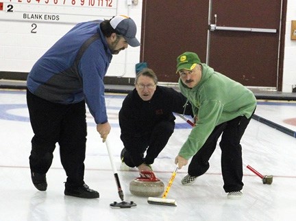 Gord Rhodes, on the left and here sweeping for the Jim Yurkevich rink at the Highwood Men&#8217;s Bonspiel, said he&#8217;s optimistic the Foothills Triple Crown of Curling