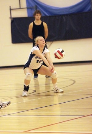 Strathcona-Tweedsmuir Spartan Victoria Romanow digs out a serve against the Holy Trinity Academy Knights in the FAC semifinal on Nov. 6 at STS.