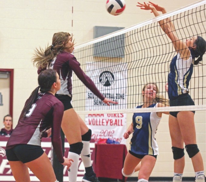Foothills Falcon Maddi Turbach has her spike blocked by a Bow Valley Bobcat during the Falcons&#8217; straight sets loss in the 4A South Central Zones, Nov. 16 at the