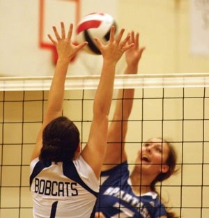 Strathcona-Tweedsmuir Spartan Arielle Beauchesne tips a ball over a Bishop O&#8217;Byrne Bobcat at the Falcon Classic earlier this month. The Spartans are making a return