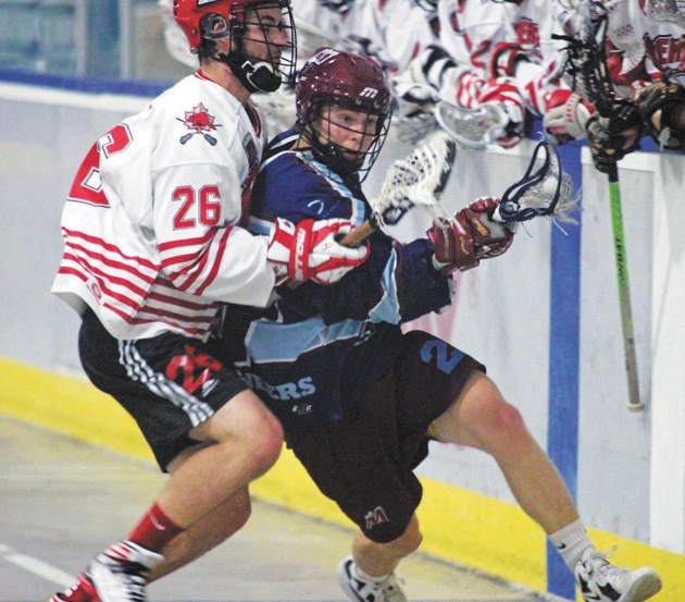 Okotoks Raider Kyle Burrell (left) and Calgary Mountaineer Jordan Felker collide during the Jr. A championship series in August. The Raiders will again compete in the RMLL