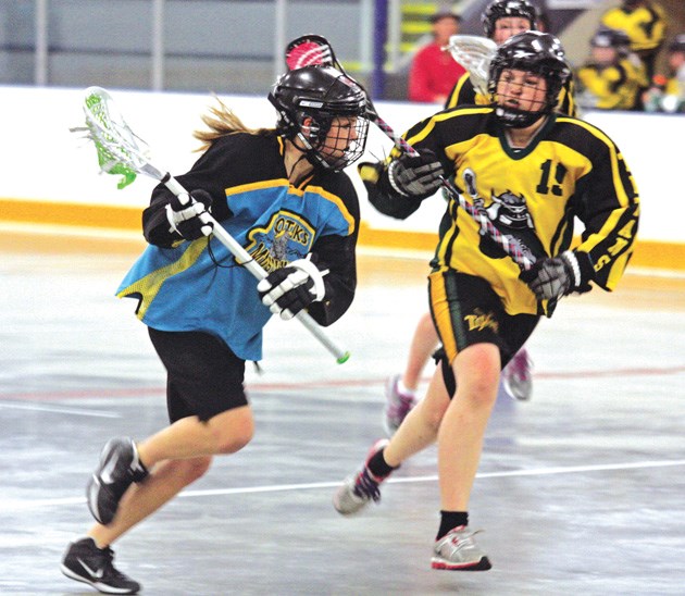 Okotoks Mustang Kristina Piche carries the ball up the floor during the Bantam girls box lacrosse provincial final in late June. The Okotoks Mustangs will be known as the
