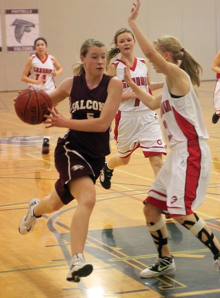 Foothills Falcon Jenna Thomson drives to the hoop in their 77-66 victory over the Bishop Grandin Ghosts in the Bishop O&#8217; Byrne Invitational tournament Feb. 23 in Calgary