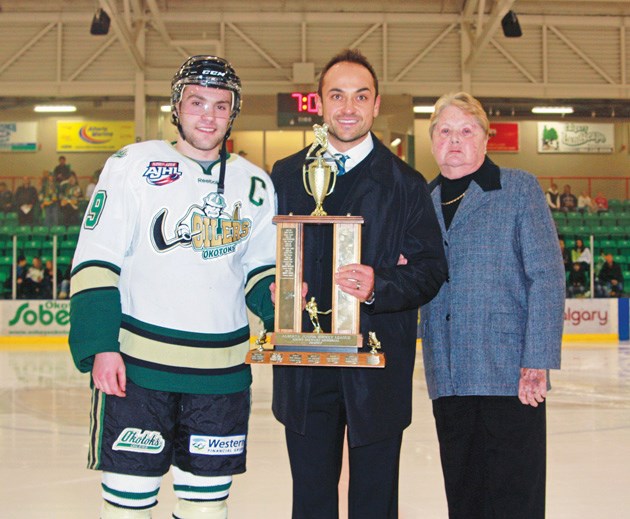 Ryan Bartoshyk, here presenting former Okotoks Oilers&#8217; captain Derek Bacon with the 2012 Stewy Stewart Memorial Trophy, was appointed AJHL commissioner on March 4.