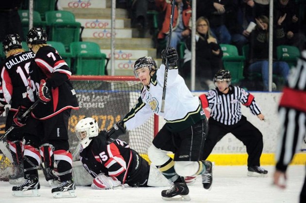 Referee Shaun Harris, right, calls a goal during a Camrose Kodiaks and Okotoks Oilers playoff game in 2011. The High River native is hoping for a trip to the finals this