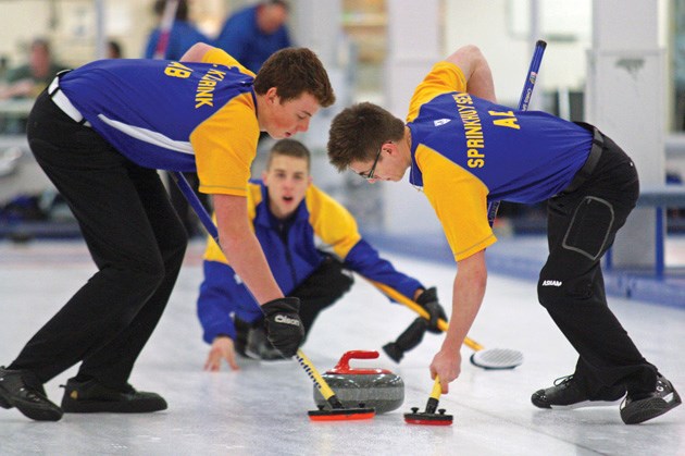Okotoks curlers Kyler Kleibrink and Christian Sprinkhuysen (left to right) sweep at the Okotoks Men&#8217;s Bonspiel on Sunday. The duo will be representing Alberta at the