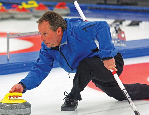 Okotokian Dave Limpert comes out of the hack during the B-final of the Okotoks Men&#8217;s Bonspiel, Sunday at the Okotoks Curling Club. Limpert defeated Jeremy Harty 7-3 to