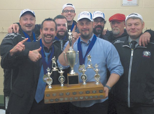 The Okotoks Bisons coaching staff and management celebrates after winning the Russ Barnes Trophy. From left to right: Lorne Dielissen, Jay McFarlane, BJ Horsey, Cale Granson, 