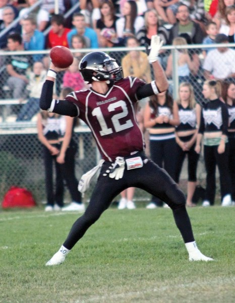 Falcon quarterback Taylor Armsworthy uncorks a pass in Foothills&#8217; 42-21 victory over the Harry Ainley Titans last fall in Okotoks. Armsworthy plans to play his college
