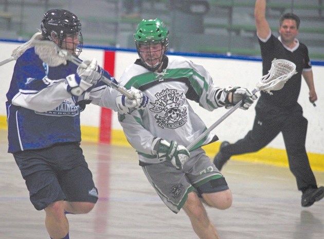 Okotoks Sr. Raider David Grant, right, gets past a Calgary Mountaineer defender during the Mountaineers&#8217; 11-9 win Saturday at the Stu Peppard Arena in Calgary. Okotoks