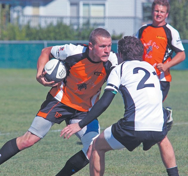 Foothills Lion Mike Rinvold, here carrying the ball during Calgary Rugby Union play last season, scored one of six trys in Foothills&#8217; 34-24 road victory over the