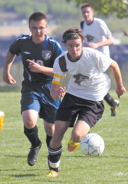 Foothills Falcon striker Jared Nudd goes in on a breakaway during the Falcons&#8217; 4-3 loss to the Notre Dame Collegiate Timberwolves on May 15 at Kinsmen field.