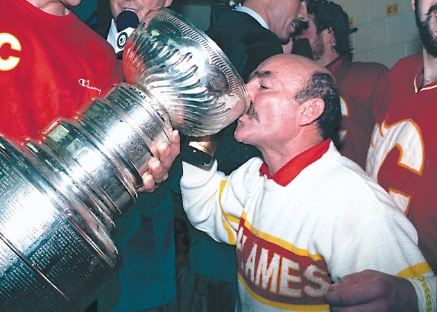Jim &#8216;Bearcat&#8217; Murray drinks out of Lord Stanley&#8217; s mug after the Calgary Flames won the Stanley Cup in 1989. Murray was the team&#8217; s athletic trainer.