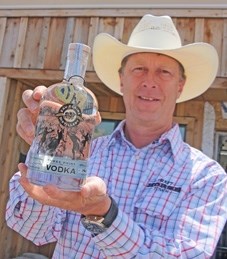 Eau Claire Distillery owner David Farran holds a bottle of his Three Point Vodka. The vodka, the distillery&#8217; s first product, sold out of stores within days.