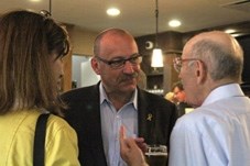 Ric McIver chats with MD of Foothills councillor Suzanne Oel and resident Al King at Sirocco Golf Club on July 22.