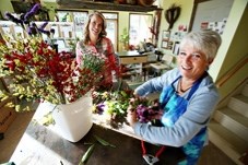 Nature Arranged owner Bev Geier, right, with fellow florist Kate McBee, is already benefiting from workshops provided through the Community Futures Highwood.