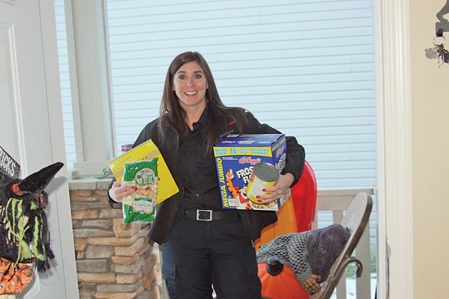 Black Diamond firefighter Jamie Kline is one of many firefighters going door to door in Black Diamond, Turner Valley and Longview on Nov. 3 and 4 to collect food and cash