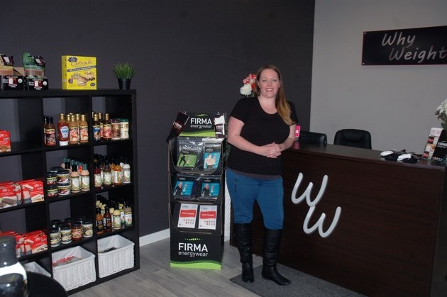 Kristen Gilmour, owner of Why Weight in Okotoks, looks over the business last week. The business, which opened in October 2014, was part of continued growth of the