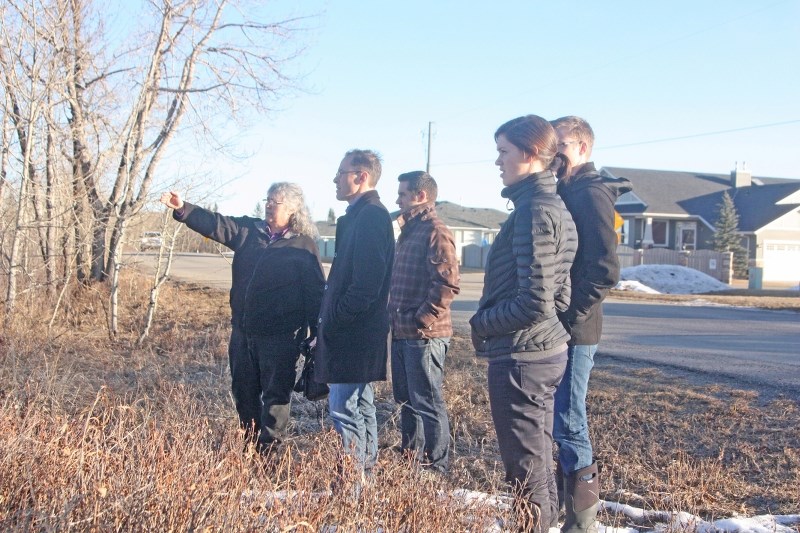 Roxanne Walsh explains Turner Valley&#8217; s water situation to university professor Shaun Fluker and his students Lee Carter, Celeste Feick and Russell Patterson while