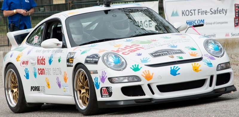 Brent Thorkelson drives his handprint-covered Porsche GT3 911 to raise funds for Kids Cancer Care during the Knox Mountain Hill Climb which takes place in Kelowna, B.C. every 