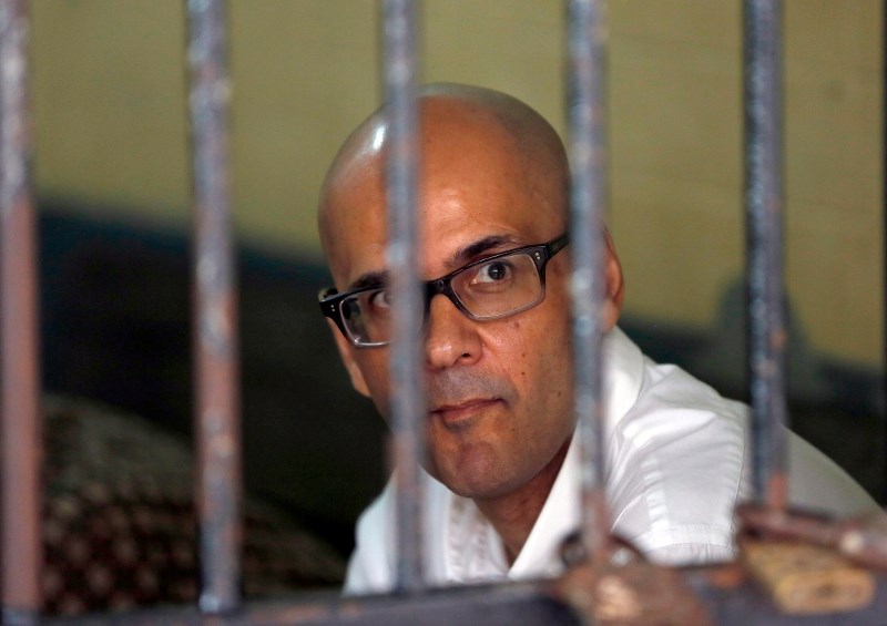 Neil Bantleman sits inside a holding cell prior to the start of his trial at South Jakarta District Court in Jakarta, Indonesia on March 12. An Indonesian court has found