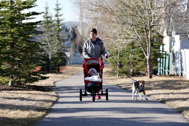 Martina Cukanova walks down a pathway in Crystal Shores. A committee is hoping to improve active transportation in Okotoks.