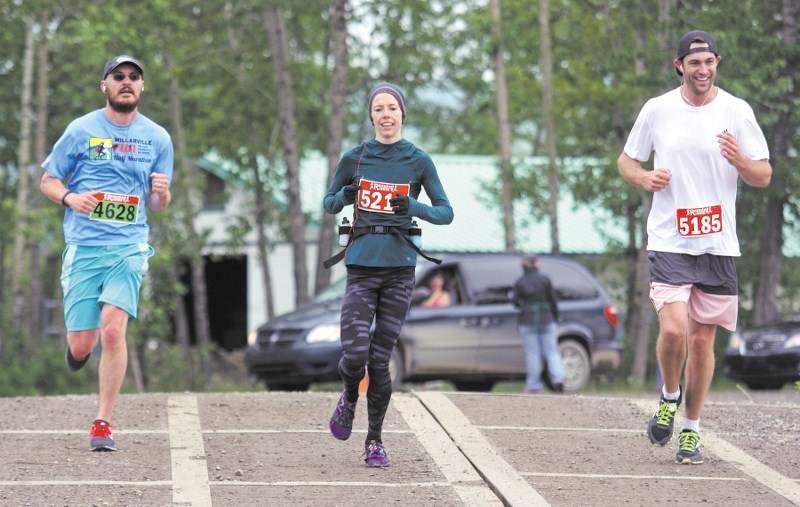 Three runners compete in last year&#8217; s Millarville Half Marathon. This year&#8217; s event takes place on June 13.