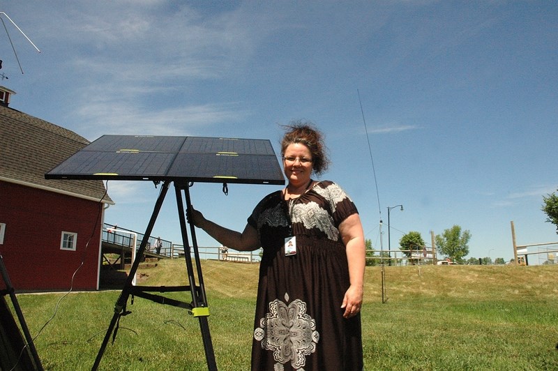 Calgary amateur radio operator Ginette Houle prepares to send out a message during the 2015 Field Day, sponsored by the American Amateur Radio League, in High River on June