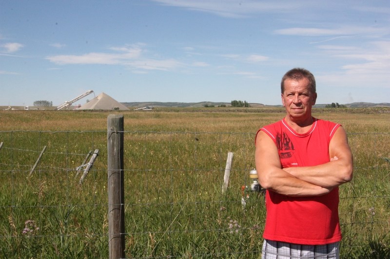 Andrzej Dziuba, who lives just south of a Black Diamond area gravel pit that recently began operation, is tired with the amount of dust he gets on windy days. Several