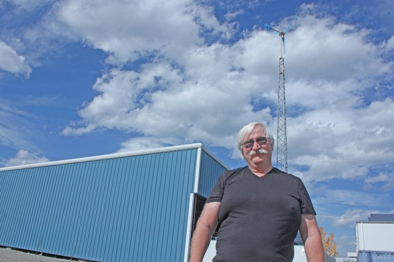 Les Quinton, with the Town of Black Diamond, stands in front of the Scott Seaman Sports Rink, which will be among the energy-efficient projects showcased at Green Energy