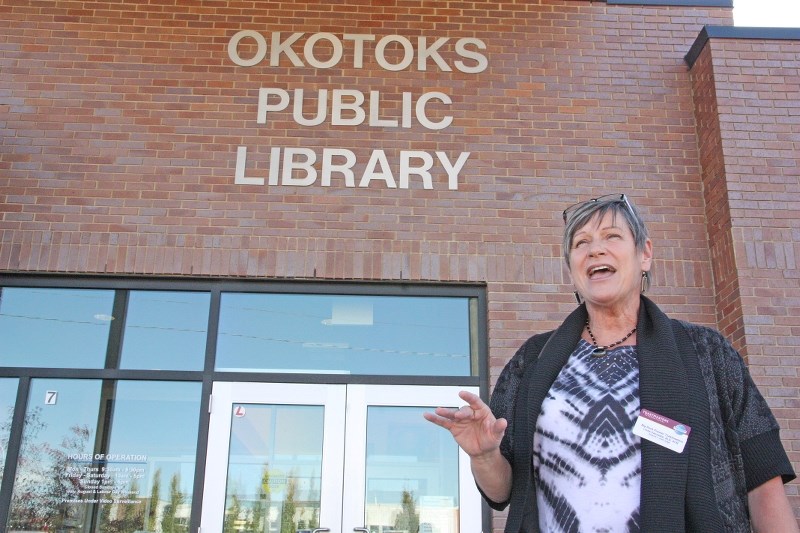 Linda Vanneste, the treasurer of Big Rock Pioneer Toastmasters, practices her speech ettiquette outside the Okotoks Public Library. The club held a speech competition on Oct. 