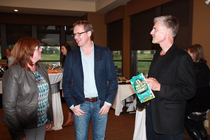 Doug Griffiths, centre, chats with High River councillors Kathy Couey and Peter Loran prior to his presentation in High River on Oct. 1.