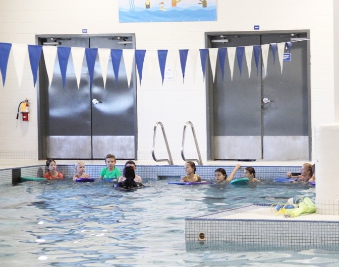 Students take part in swimming lessons at the Okotoks Aquatic Centre on Oct. 5.