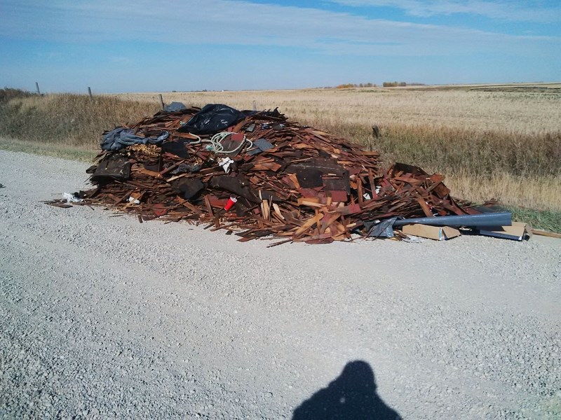 A large pile of shingles, wood and other garbage was left on a rural gravel road, instead of taken to the landfill in one of two recent large cases of illegal dumping.