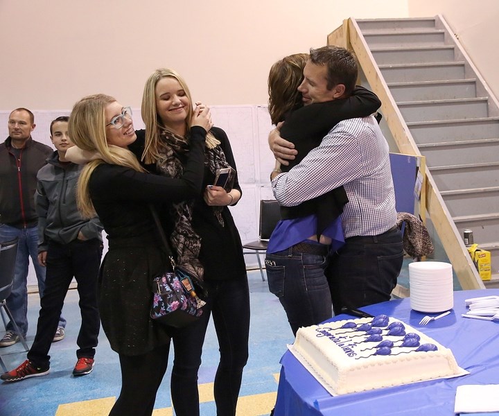 Newly elected Foothills MP John Barlow hugs his wife Louise as he celebrates his victory in Monday night&#8217;s election as daughters McKenna, left, and Kinley look on.