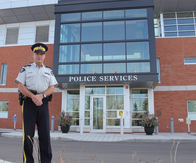 Staff Sergeant Jim Ross stands outside the Okotoks RCMP detachment at the Southridge Emergency Services building in Okotoks on Oct. 19.
