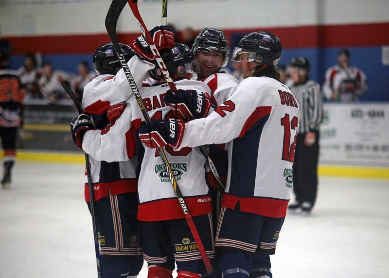 The Okotoks Bisons celebrate Spencer Barlow-Lakusta&#8217;s second goal in the team&#8217;s 5-1 win over the High River Flyers on Nov. 15 at the Bob Snodgrass Recplex.