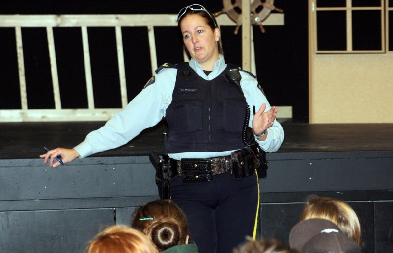 Turner Valley RCMP Cpl. Tiffany McGregor discusses bullying and the law with Oilfields School Grade 7 students in Black Diamond on Nov. 19. Oilfields participated with five