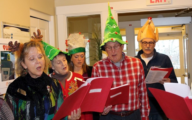 Some of the Hopsice Carollers roam the halls entertaining patients and their families during the Christmas season. They are, from left, Bonnie Wiebe, Jane Welsh, Cindy de
