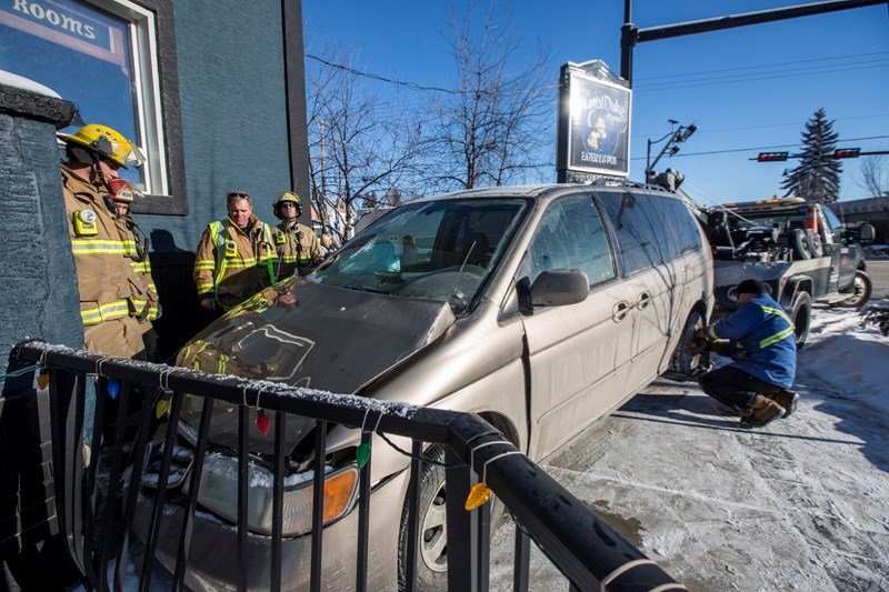 A minivan collided with a truck before sliding into the side of the Royal Duke Hotel in Okotoks on Jan. 8.