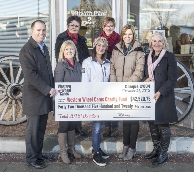 The Western Wheel Cares Charity fund raised $42,520.75 for five foothills charities. Front row, left to right: Matt Rockley, Western Wheel; Sherrie Botten, Rowan House
