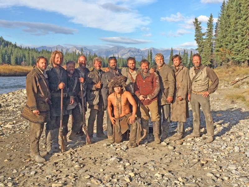 Guy Bews (centre with sunglasses) and other stuntmen take a break from filming The Revenant in fall 2014.