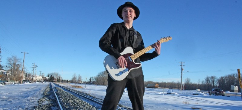 Joe Kleinsasser, 14, strikes a pose with his guitar in Okotoks on Jan. 18. Kleinsasser is one of 10 finalists in the Youth Blues Challenge.