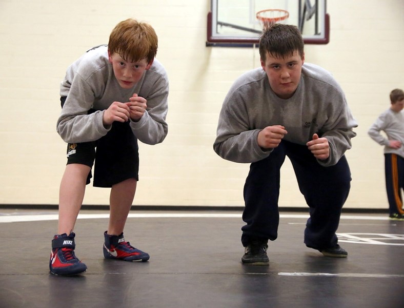 Okotoks Wrestling Club members Ryker Blankert, left, and Carson Remus have qualified for the Alberta Winter Games in Medicine Hat next month.