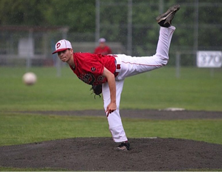 Graeme Cherry, here pitching for the Okotoks Red Dawgs, credits the Dawgs&#8217; program for finding him a spot into Northeastern College Plainsmen in Colorado.