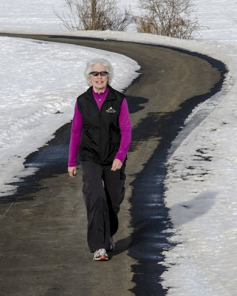 Linda Nelson, chairwoman of the High Country Wellness Coalition, enjoys a stroll in Black Diamond. The coalition is inviting people across the region to participate in Winter 