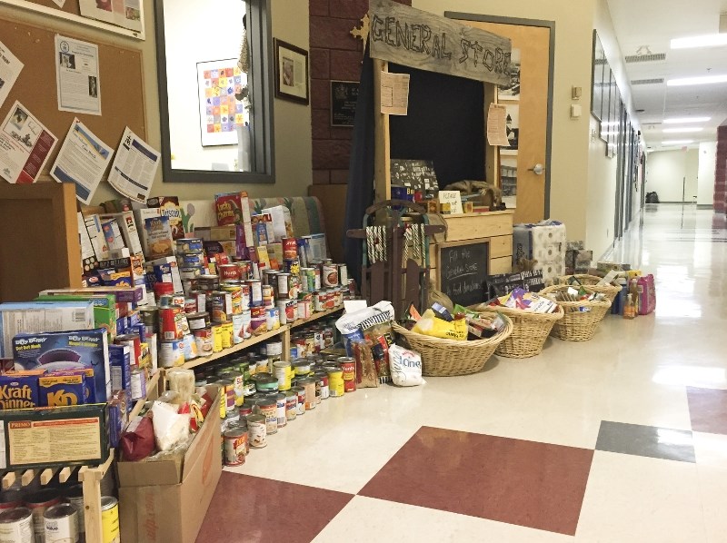 Students at St. Mary&#8217;s School in Okotoks collected food to fill the &#8220;general store&#8221; during the One School, One Book program. The school donated 800 pounds